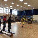 Children playing team dodgeball game at the Fit 4 Future Foundation Holiday Activities Camp